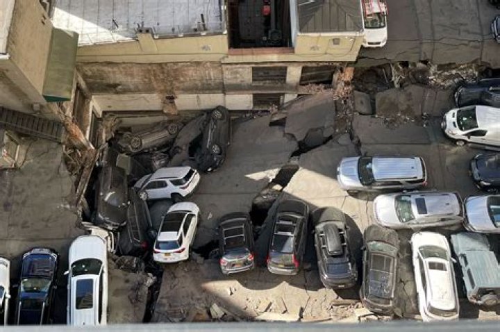1 dead, 5 injured after stolen vehicle collision causes building collapse