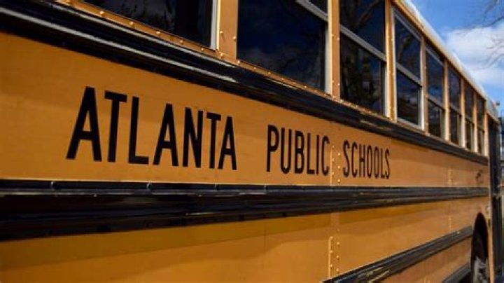 Four students were wounded in a drive-by shooting outside an Atlanta high school, officials say