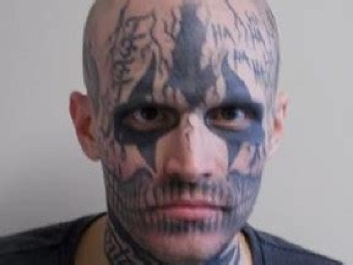 Police seeking 'dangerous' man with distinctive facial tattoos